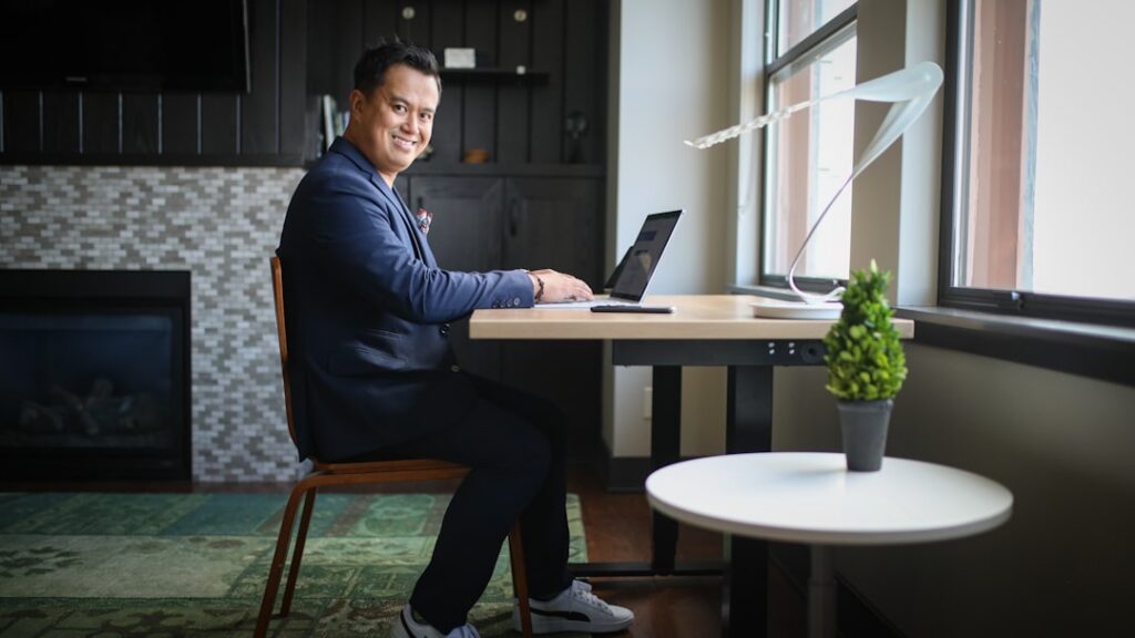 Golf course owner reviewing financial paperwork at a desk inside the clubhouse