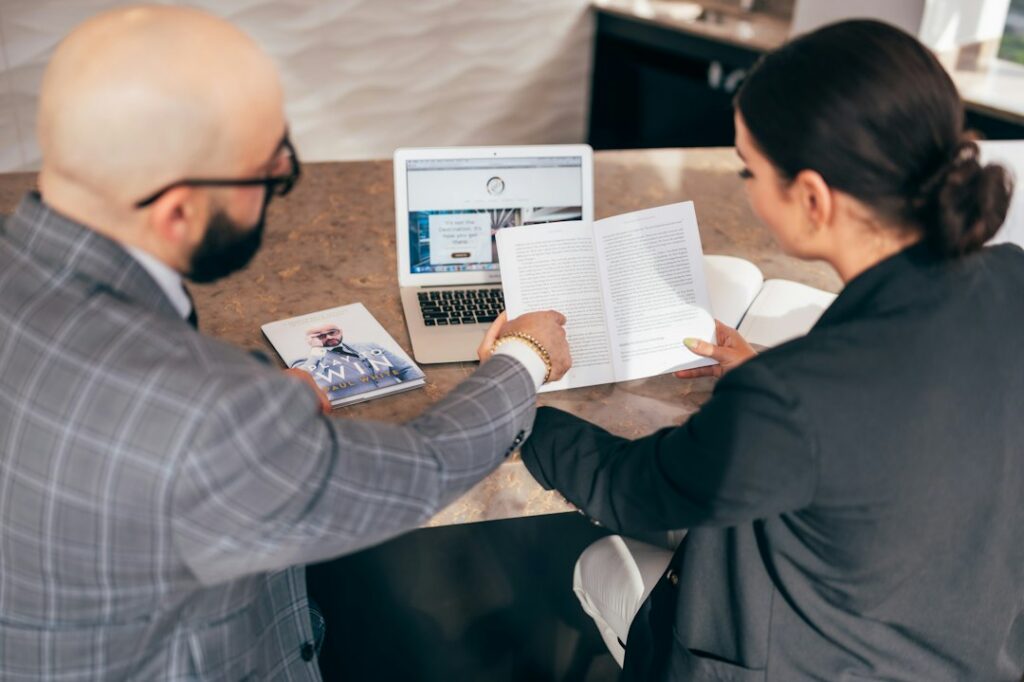 Business owner and advisor shaking hands over a negotiated agreement