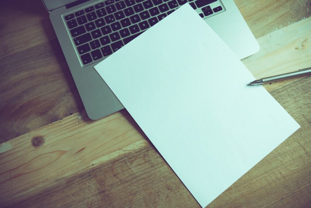 Financing contract with fine print on a desk next to a pen