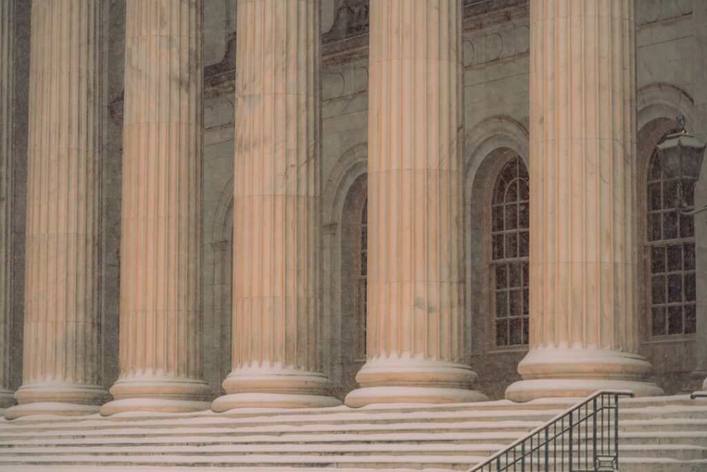 Courthouse steps representing legal and regulatory oversight of lending