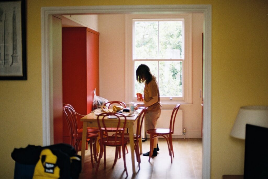 Business owner reviewing a financing offer letter at a kitchen table