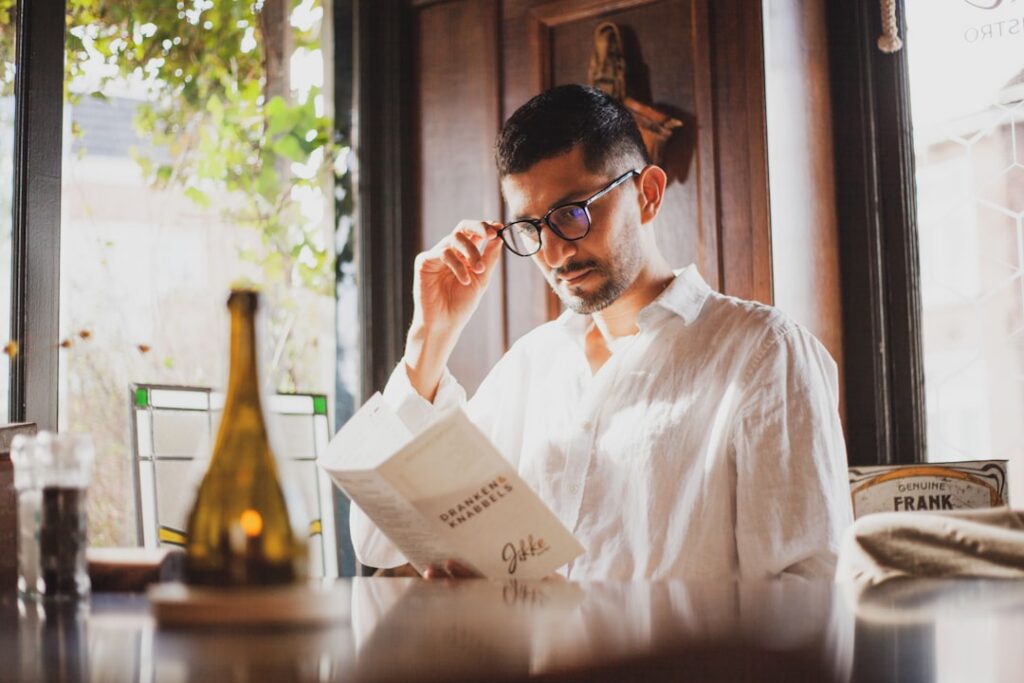 Small business owner reviewing a merchant cash advance contract at a desk
