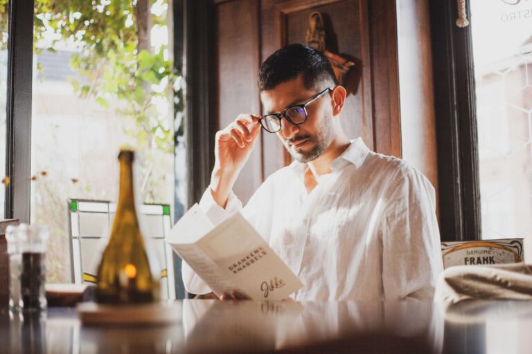Small business owner reviewing a merchant cash advance contract at a desk
