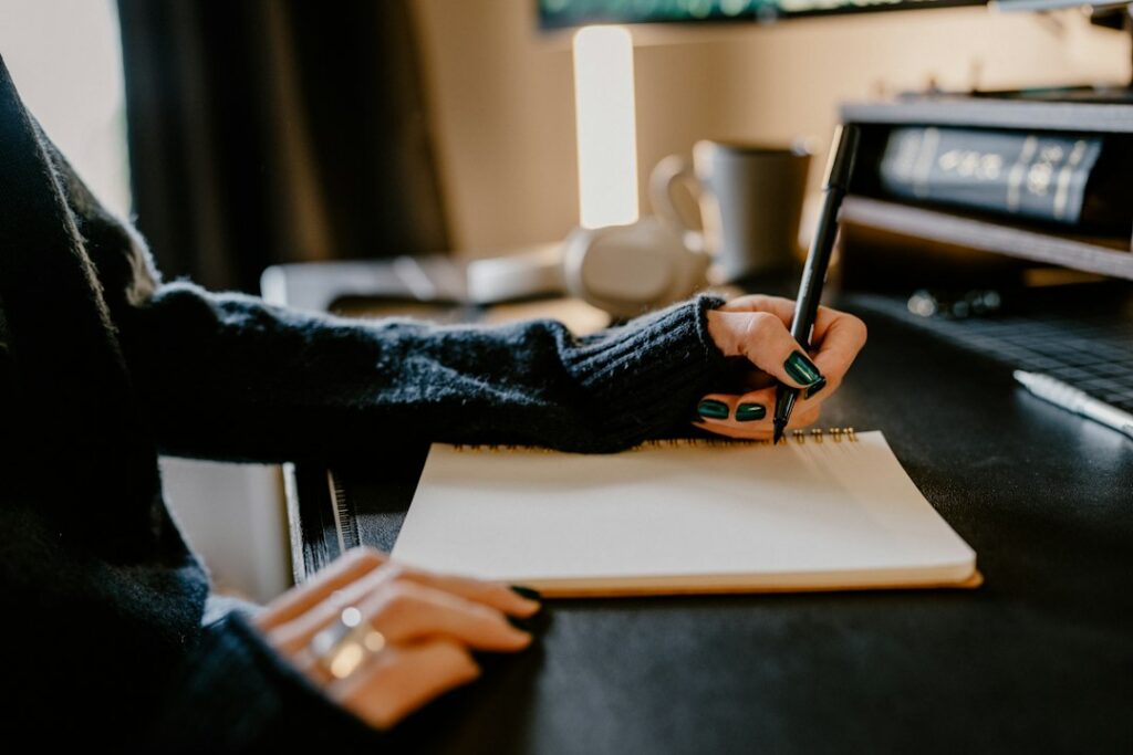Hand signing a business financing contract