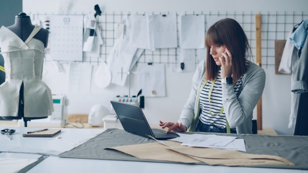 Small business owner checking a low bank account balance on a phone