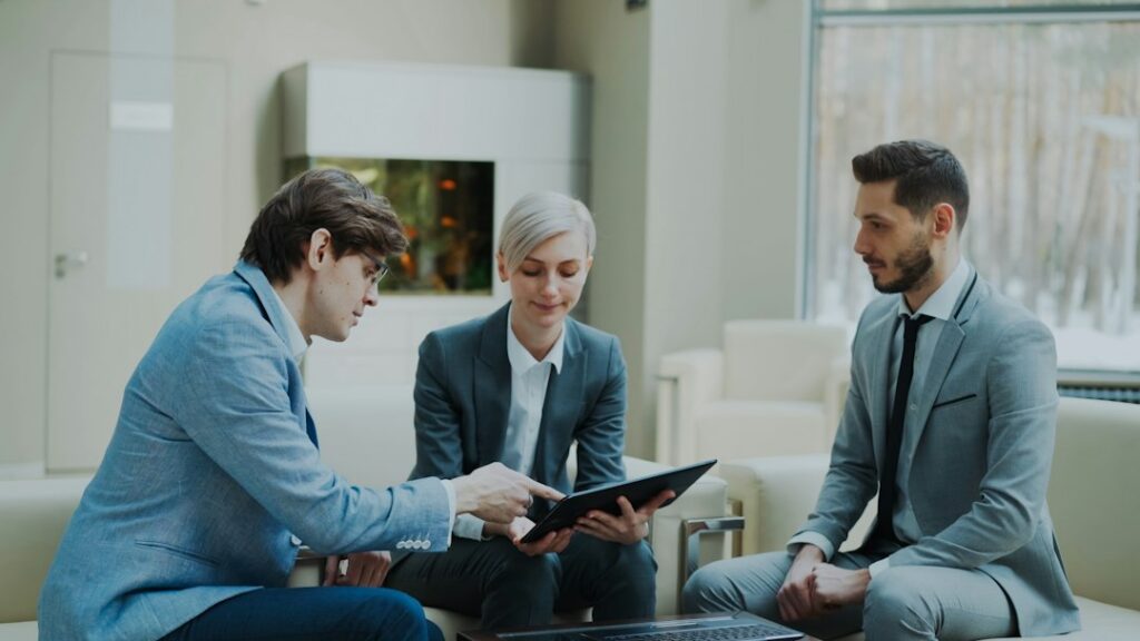 Business owner reviewing legal documents with an attorney across a desk