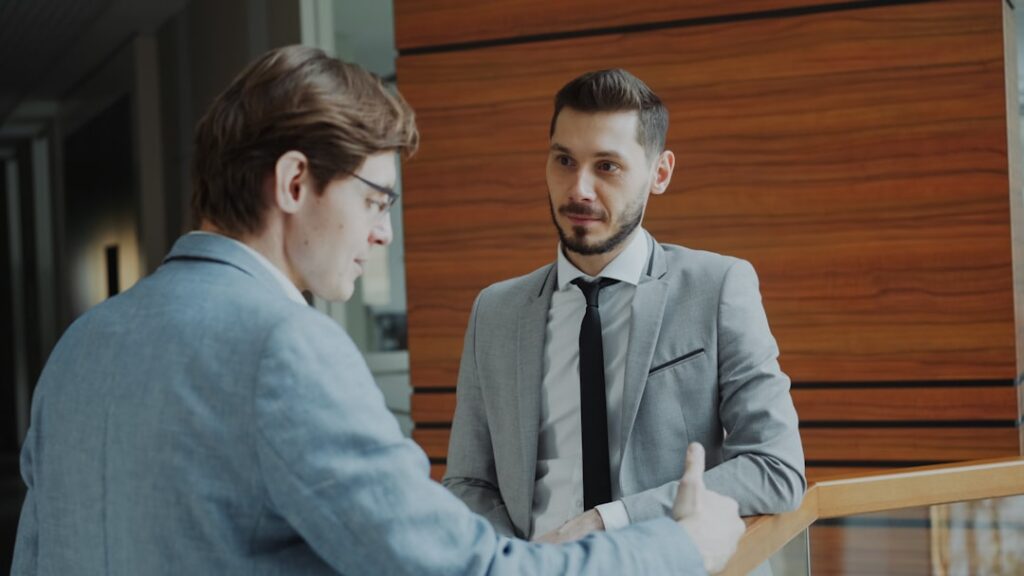 Business owner shaking hands after a successful advisory meeting