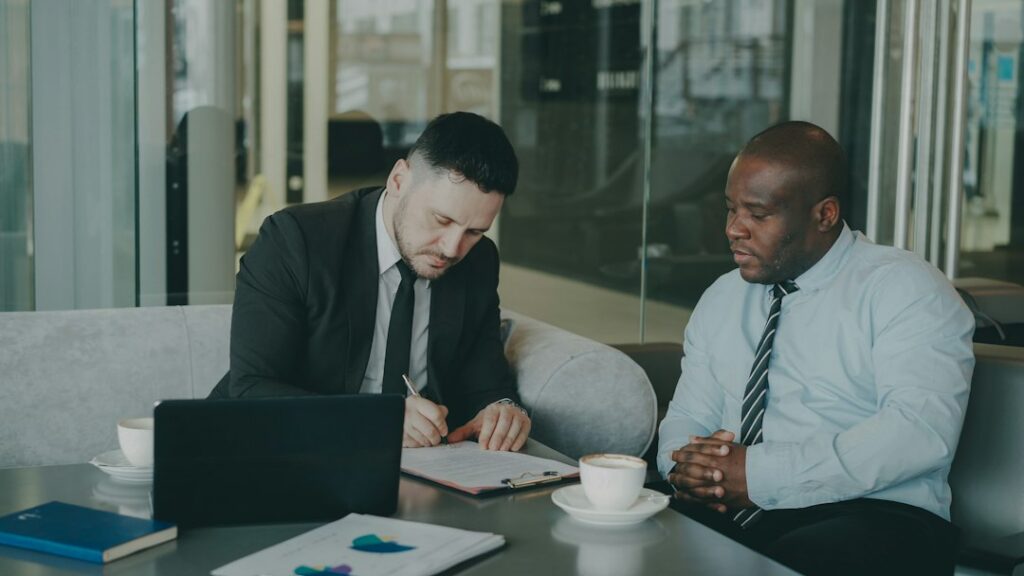 Business attorney reviewing bankruptcy filing options with a client