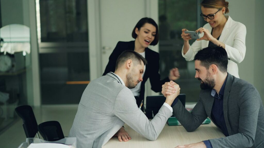 Business owner and specialist shaking hands after negotiating a resolution