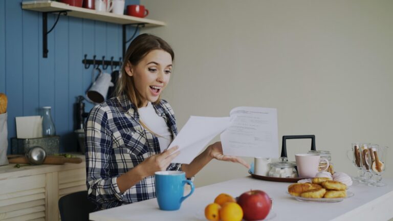 Small business owner reviewing a legal notice at their desk