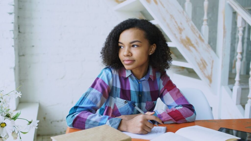 Small business owner reviewing a financing contract at a desk