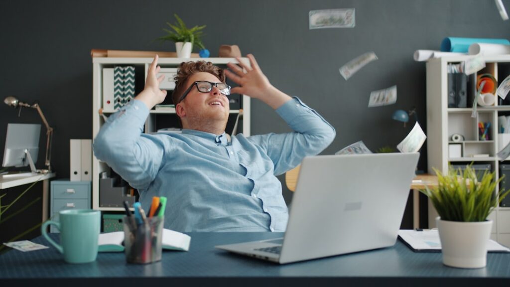 Contractor reviewing multiple bank and loan statements at a desk