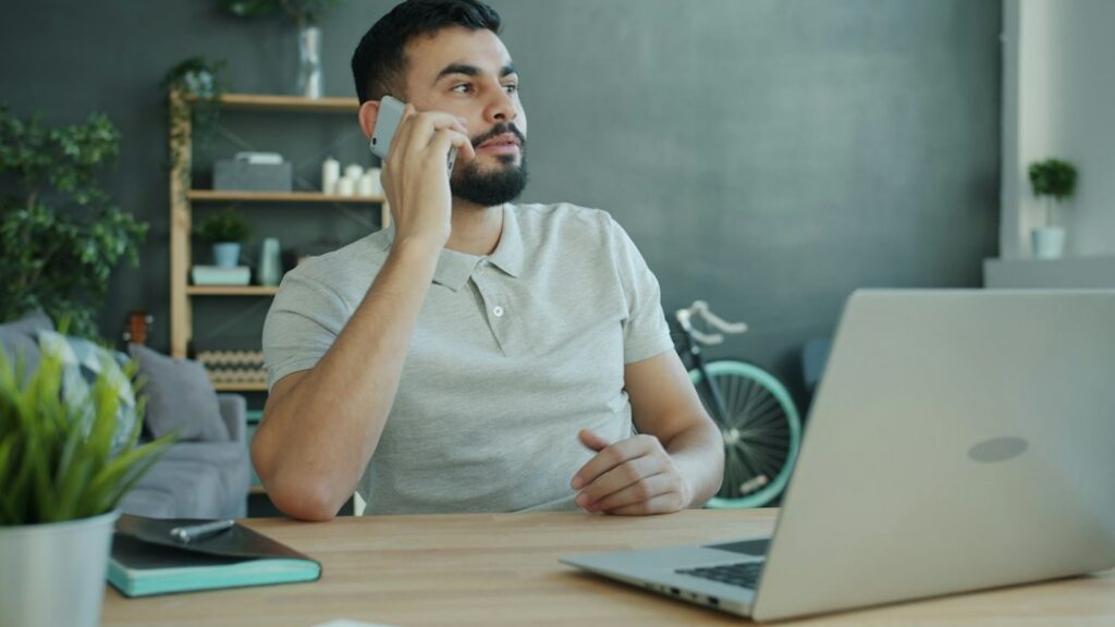 Business owner on a phone call discussing debt relief options