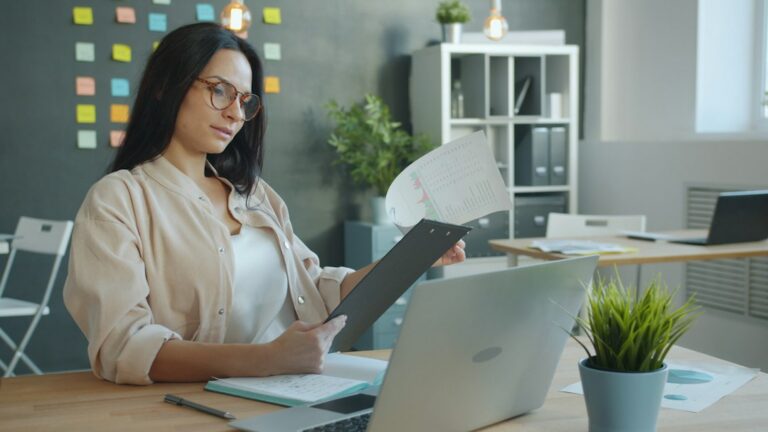 Business owner reviewing a settlement agreement with an attorney
