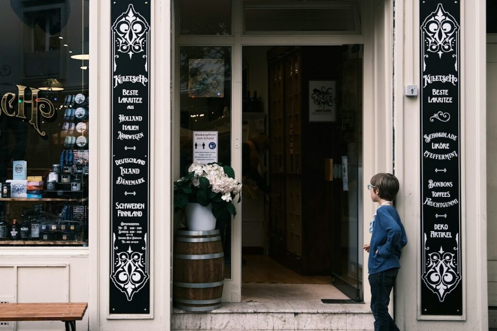 Confident small business owner standing outside their shop ready for the season