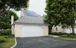 Solar installation crew mounting panels on a home roof