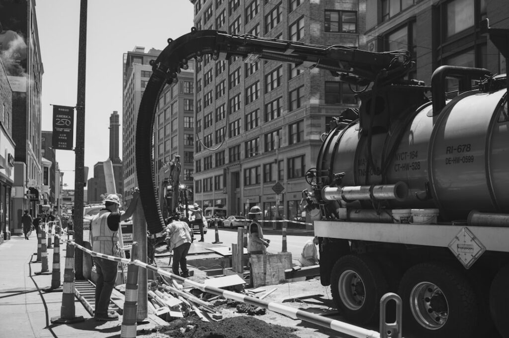 Construction crew finishing up work at a job site in early fall