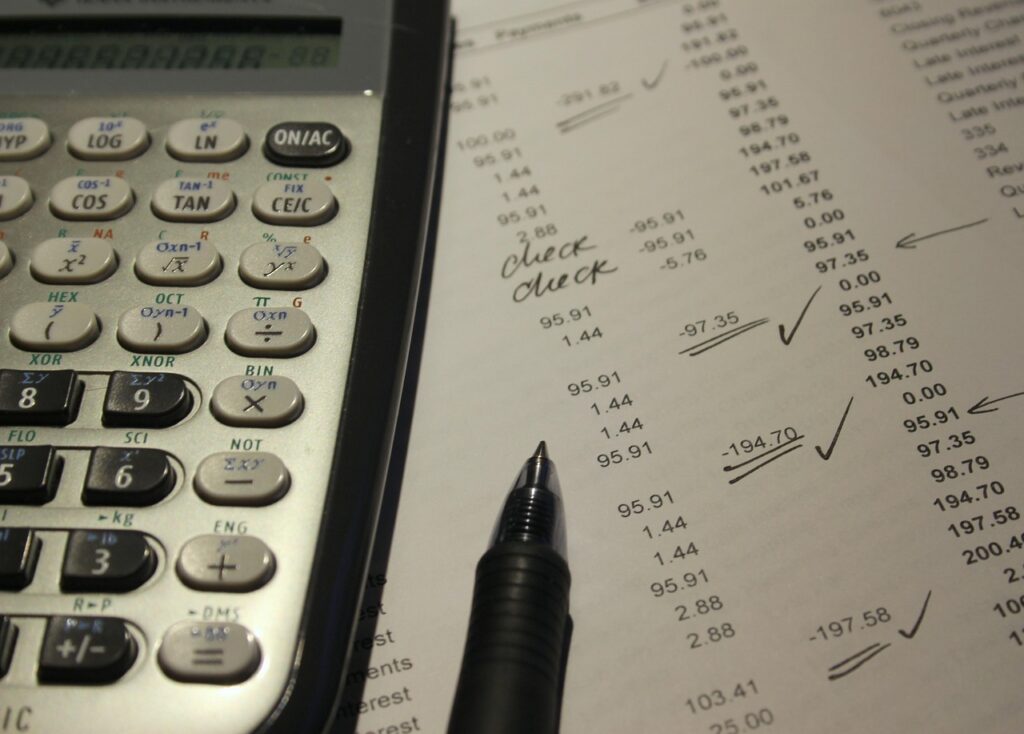 Calculator and invoices on a tire shop counter