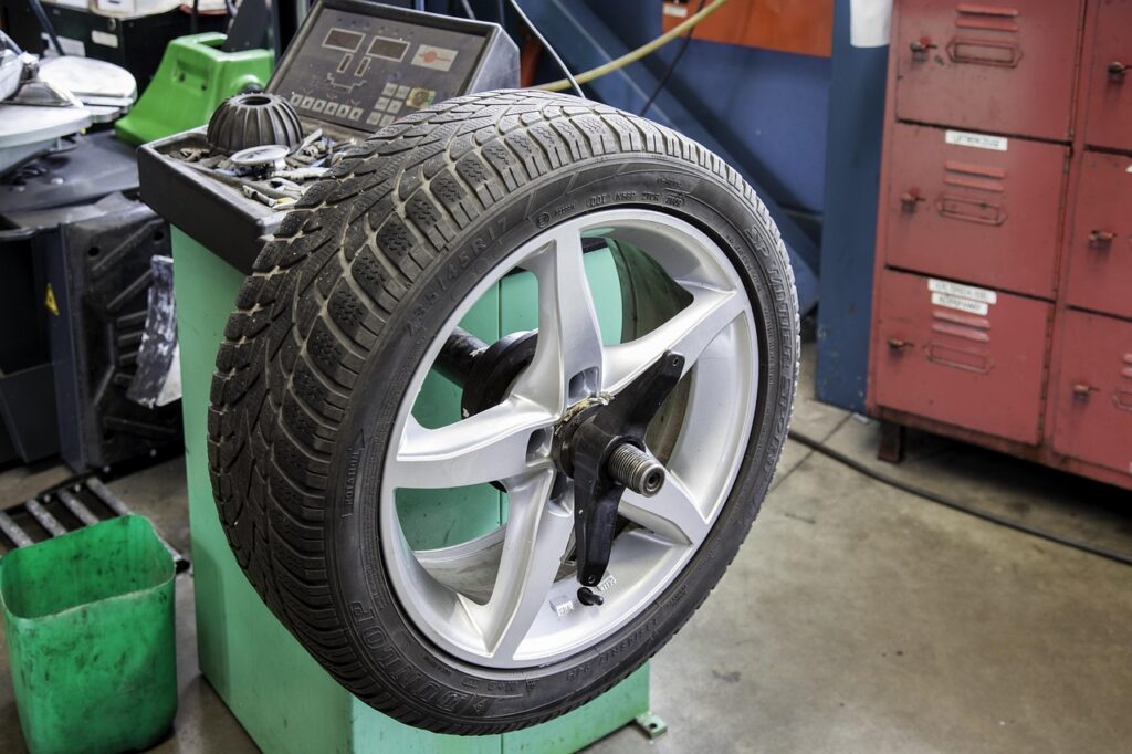 Tire shop owner counting winter tire inventory