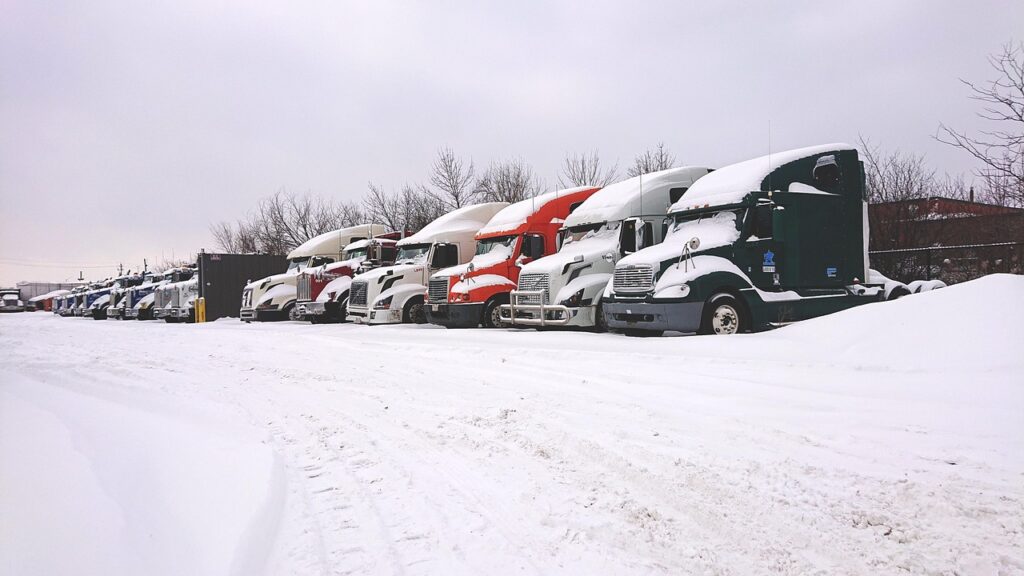 Roll-off truck parked at a small business yard