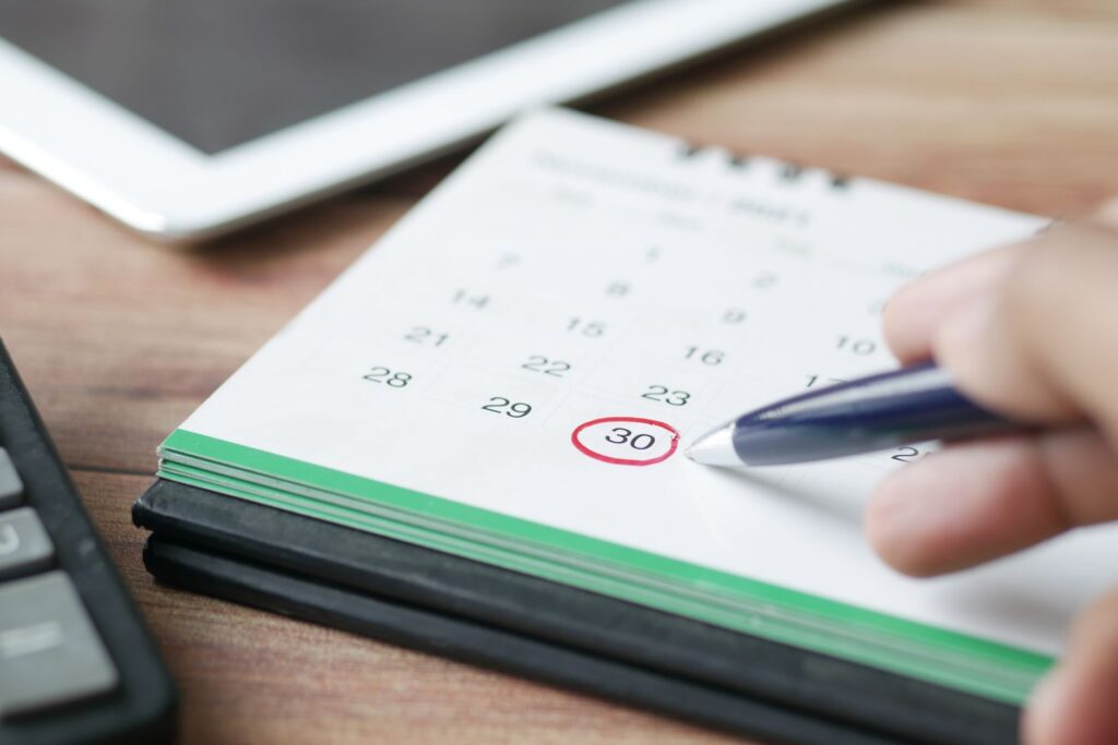Calendar due date next to a bank statement