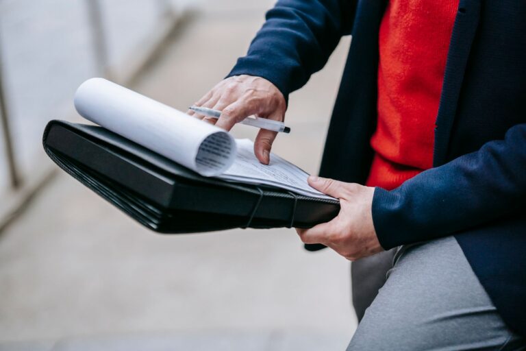 Business owner reviewing a business interruption insurance claim at a damaged storefront