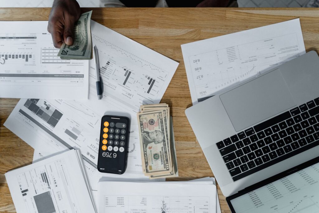 Payroll paperwork and calculator on a desk
