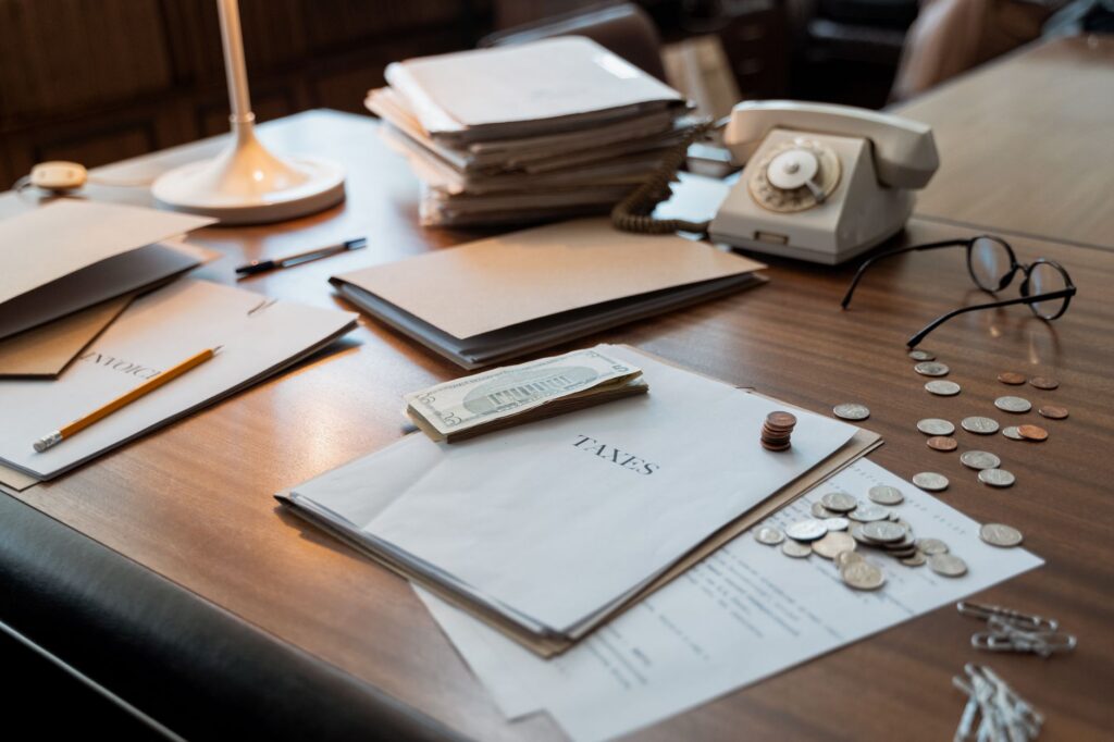 Tax notice and business ledger on a desk
