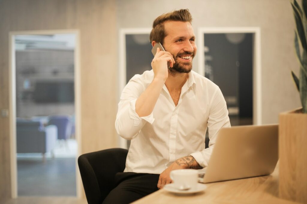 Small business owner reviewing finances on the phone
