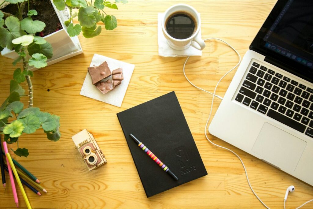 Notebook and coffee on an organized desk