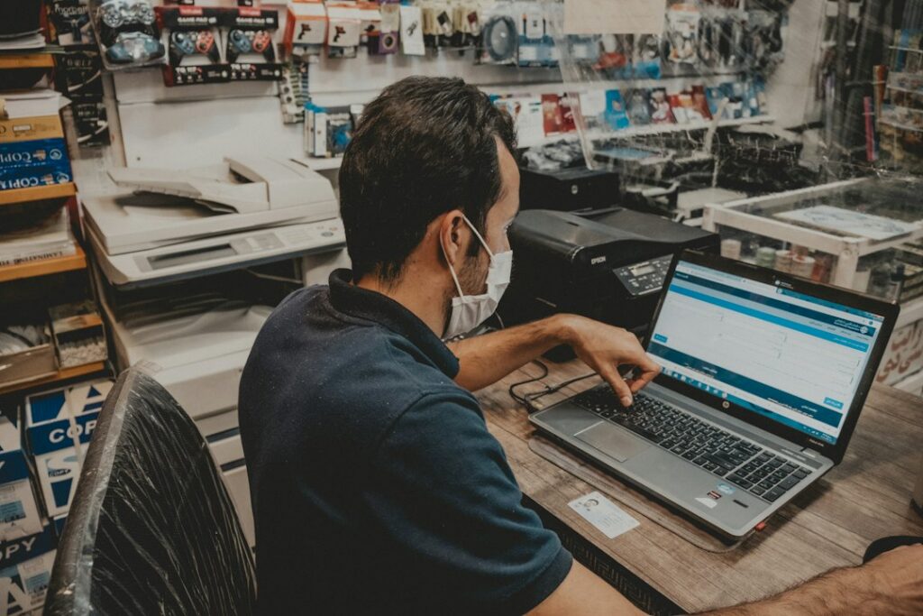 Owner reviewing an equipment quote at a workshop desk