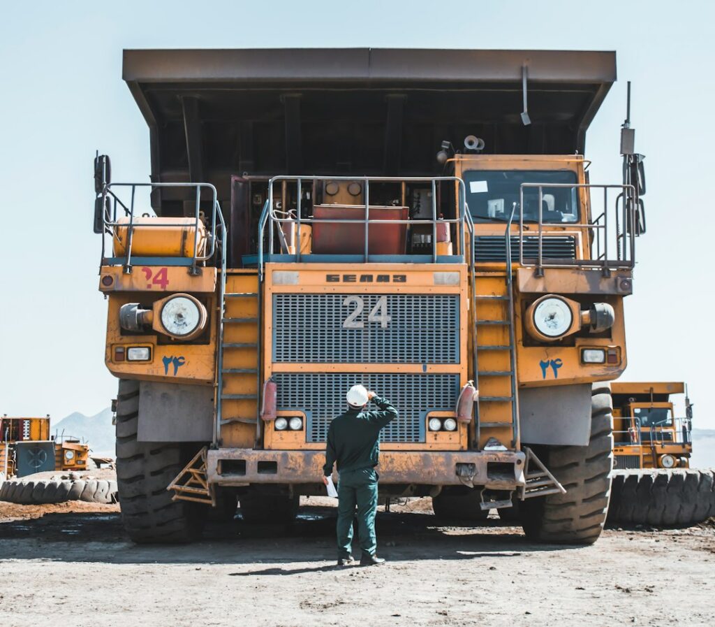 Contractor reviewing stacked bills and invoices
