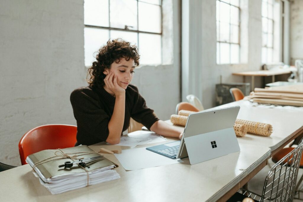 Business owner reading a letter at a desk
