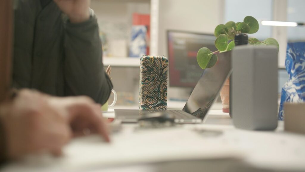 Owner negotiating at a desk with documents