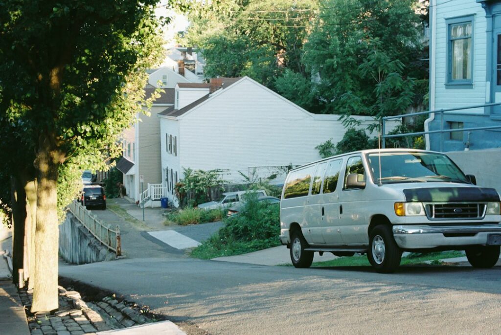 Appliance repair service van parked outside a home