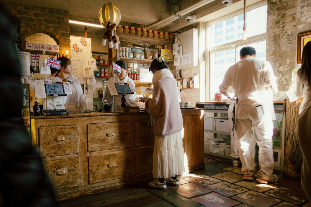 Coffee shop owner opening the register early in the morning before the shop opens