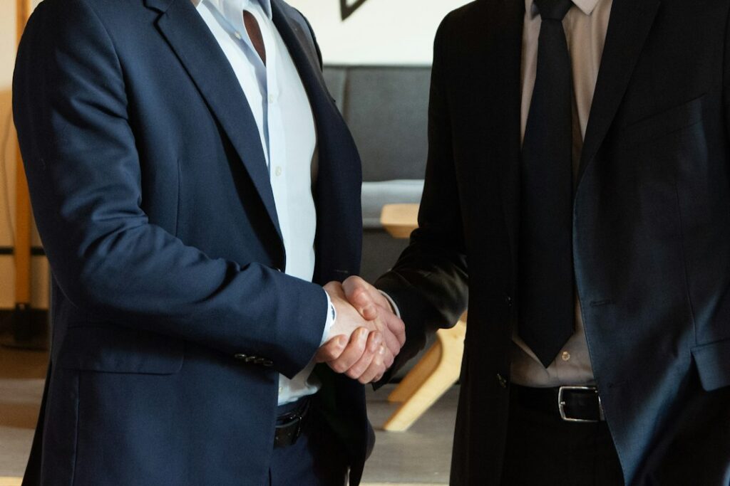Two business people shaking hands after a successful negotiation