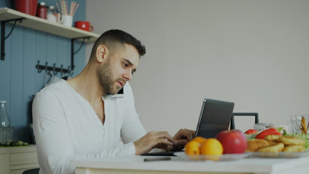 Business owner opening an insurance renewal notice at a desk