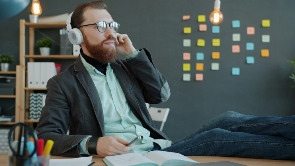 Owner on a phone call at a desk with notes