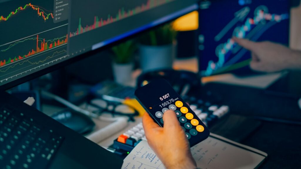 Owner reviewing a credit card statement with a calculator