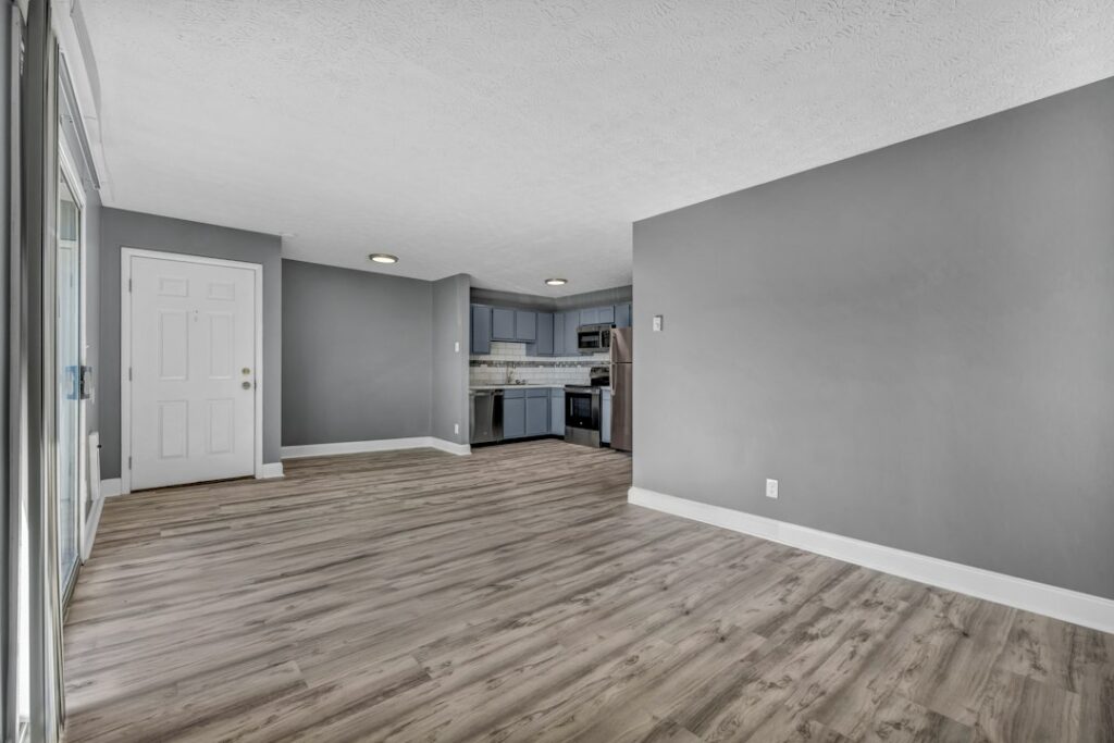 Installer laying vinyl plank flooring